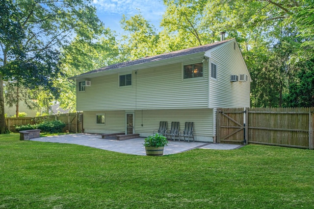 27 Columbus Ave, Kings Park, NY 11754 - back of property with a patio area, a fenced backyard, and a gate
