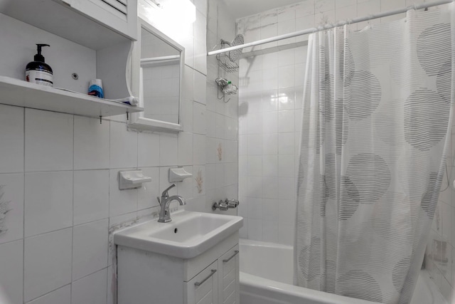 full bathroom with shower / bath combination with curtain, tile walls, vanity, and decorative backsplash