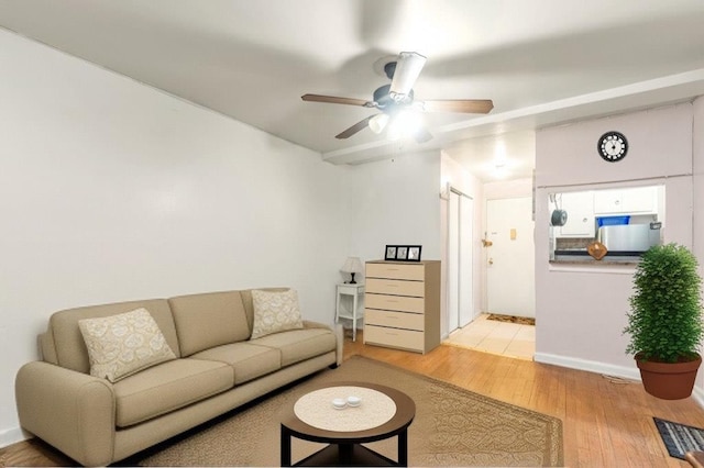 87-70 173rd St Unit 6H, Jamaica, NY 11432 - living area with light wood-style floors and ceiling fan