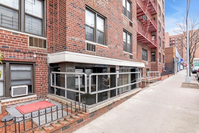 87-70 173rd St Unit 6H, Jamaica, NY 11432 - view of building exterior with cooling unit