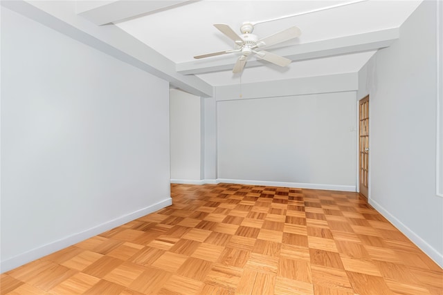 empty room with baseboards and a ceiling fan