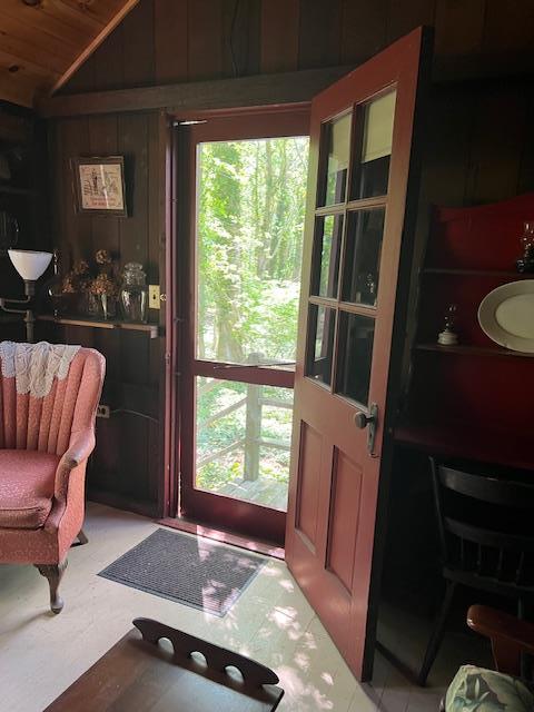71 S Railroad Ave, Jamesport, NY 11947 - entryway with vaulted ceiling, wood ceiling, and wood walls