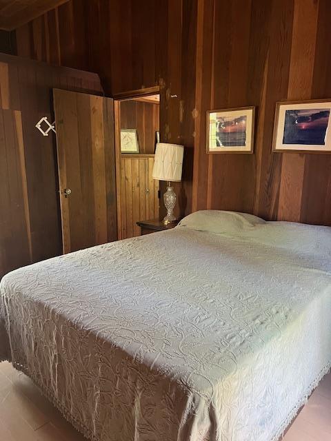 71 S Railroad Ave, Jamesport, NY 11947 - bedroom with wooden walls