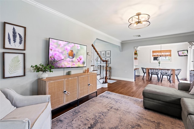 8 Vera Ct, West Islip, NY 11795 - living room featuring a chandelier, crown molding, stairs, wood finished floors, and baseboards