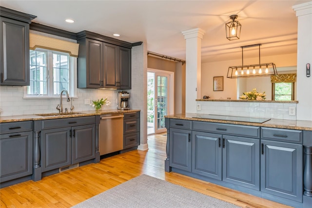 125 Hawkes Ave, Ossining, NY 10562 - kitchen featuring dishwasher, a sink, tasteful backsplash, light wood-style floors, and decorative light fixtures