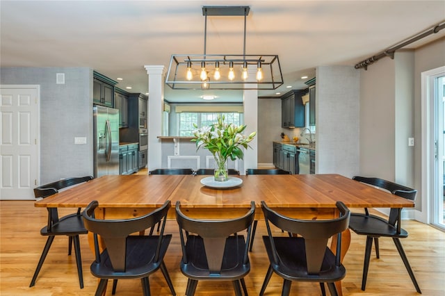125 Hawkes Ave, Ossining, NY 10562 - dining area with light wood-style floors and baseboards