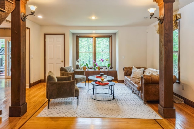 125 Hawkes Ave, Ossining, NY 10562 - living room featuring light wood-style floors, decorative columns, baseboards, and recessed lighting