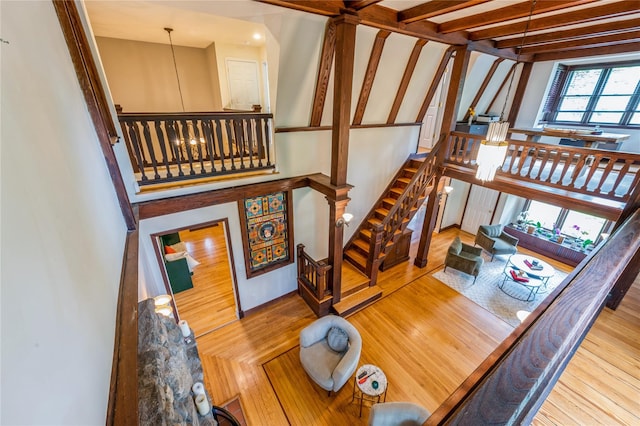 125 Hawkes Ave, Ossining, NY 10562 - staircase with wood finished floors and a chandelier