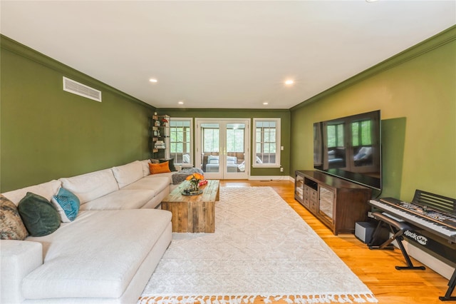 125 Hawkes Ave, Ossining, NY 10562 - living room featuring crown molding, light wood finished floors, recessed lighting, and baseboards