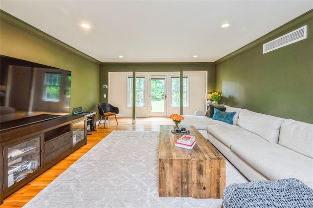 125 Hawkes Ave, Ossining, NY 10562 - living area with ornamental molding, recessed lighting, and light wood-style floors