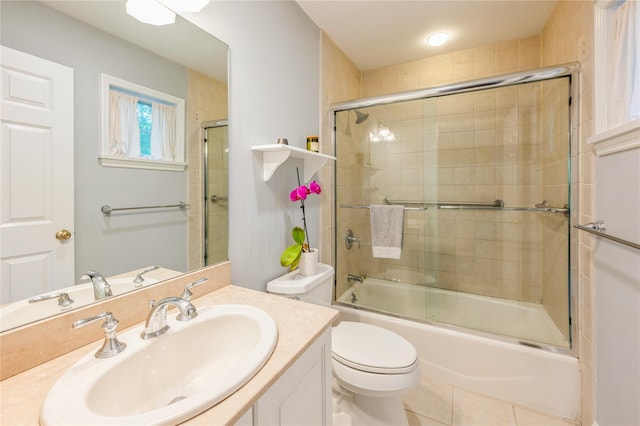 125 Hawkes Ave, Ossining, NY 10562 - full bathroom with shower / bath combination with glass door, toilet, vanity, and tile patterned floors