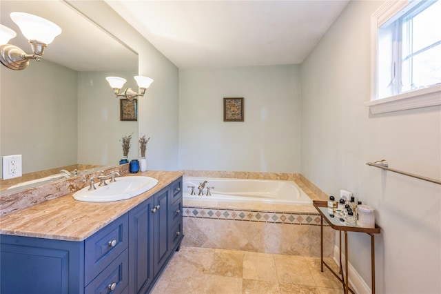 125 Hawkes Ave, Ossining, NY 10562 - bathroom with a chandelier, a bath, and vanity