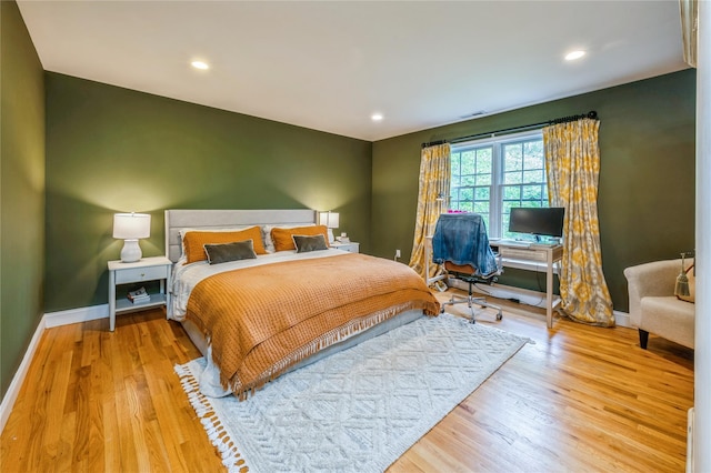 125 Hawkes Ave, Ossining, NY 10562 - bedroom with baseboards, wood finished floors, recessed lighting, and an office area