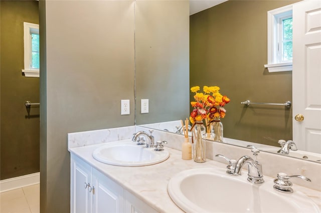 125 Hawkes Ave, Ossining, NY 10562 - full bath with double vanity, baseboards, and tile patterned flooring