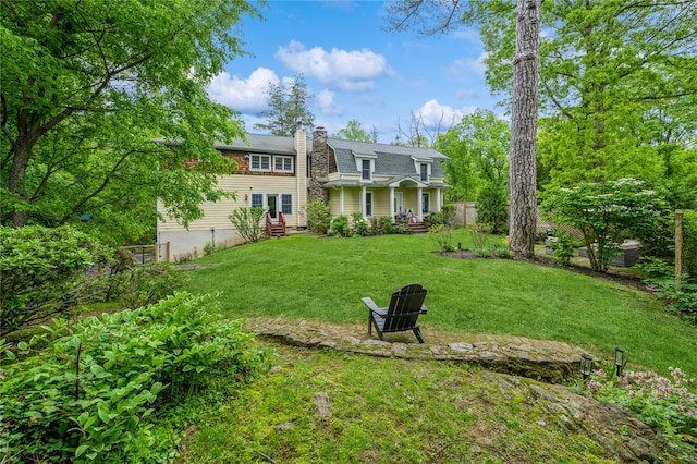 125 Hawkes Ave, Ossining, NY 10562 - rear view of property with a chimney and entry steps