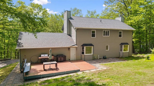 50 Maple Wood Dr, Brewster, NY 10509 - rear view of house with a chimney, a deck, a yard, and roof with shingles