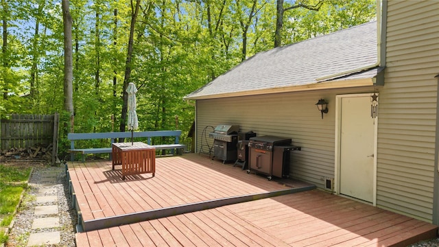 50 Maple Wood Dr, Brewster, NY 10509 - wooden deck featuring a grill, fence, and view of scattered trees