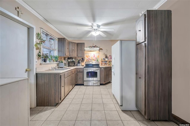 kitchen with stainless steel electric stove, a sink, light countertops, a ceiling fan, and black microwave