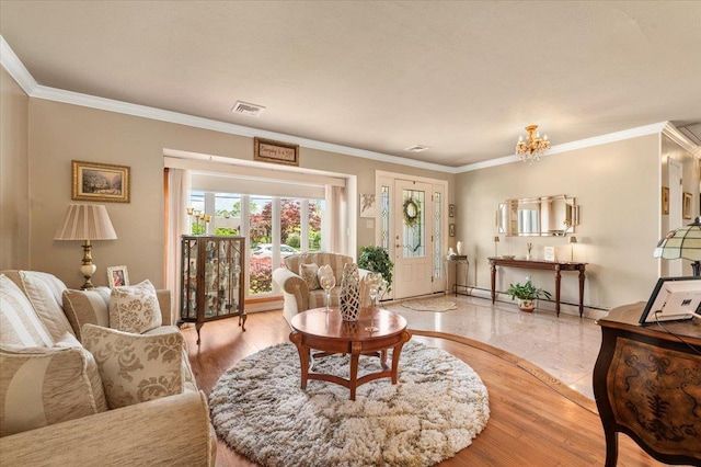living area with crown molding, a baseboard radiator, baseboards, and a chandelier