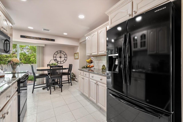 kitchen featuring black appliances, light tile patterned floors, light stone counters, tasteful backsplash, and recessed lighting