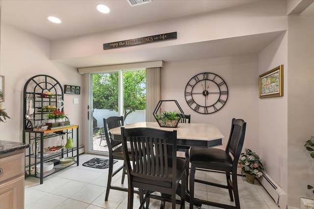 dining room featuring light tile patterned flooring, a baseboard heating unit, and recessed lighting