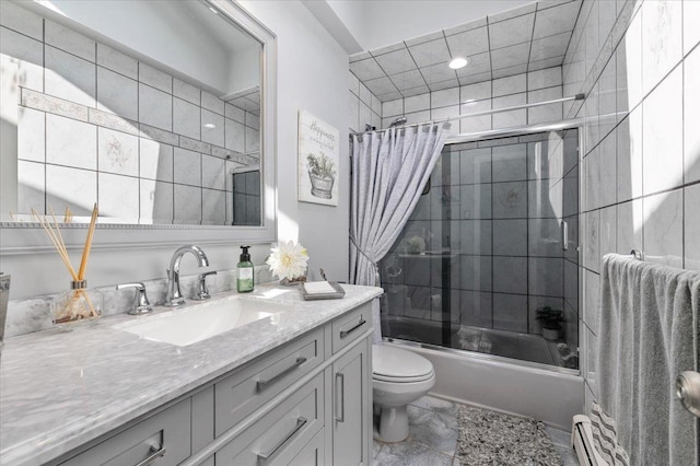 full bathroom with bath / shower combo with glass door, toilet, vanity, and baseboard heating