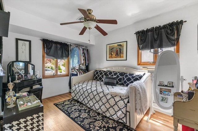 bedroom with wood finished floors and ceiling fan