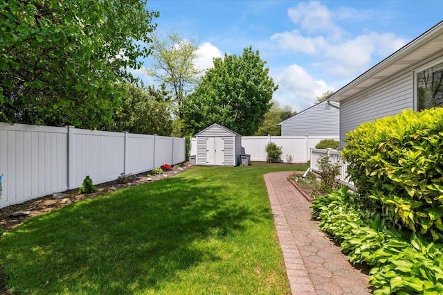 view of yard featuring a storage shed and an outbuilding
