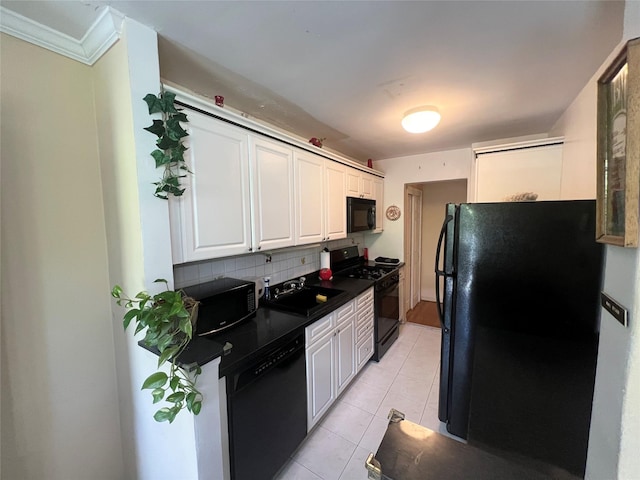 86-10 151st Ave Unit 4G, Howard Beach, NY 11414 - kitchen featuring black appliances, decorative backsplash, dark countertops, and white cabinets
