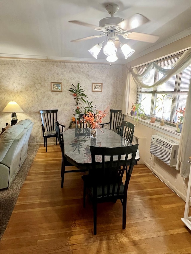 86-10 151st Ave Unit 4G, Howard Beach, NY 11414 - dining space with ornamental molding, ceiling fan, a wall mounted air conditioner, and wood finished floors