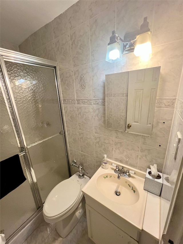 86-10 151st Ave Unit 4G, Howard Beach, NY 11414 - bathroom featuring tile walls, a stall shower, vanity, and toilet
