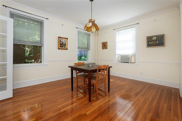 35-31 78th St Unit 3, Jackson Heights, NY 11372 - dining space featuring wood-type flooring, crown molding, baseboards, and cooling unit