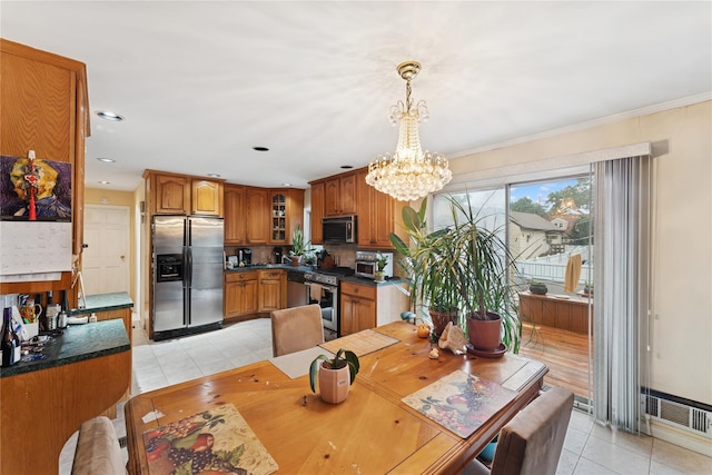 539 Keller Ave, Elmont, NY 11003 - dining area with light tile patterned floors, a chandelier, recessed lighting, and crown molding