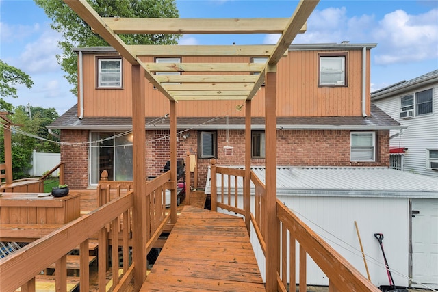 539 Keller Ave, Elmont, NY 11003 - back of house with brick siding, roof with shingles, and a wooden deck