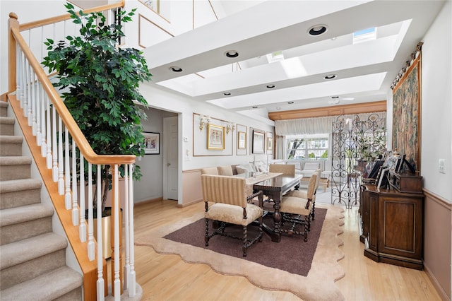 58 Roundtop Rd, Yonkers, NY 10710 - dining room featuring a skylight, light wood finished floors, and stairway