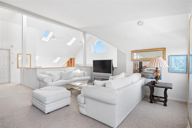 58 Roundtop Rd, Yonkers, NY 10710 - living room with a skylight, carpet flooring, vaulted ceiling, and baseboards