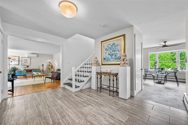 5 Bellwood Ln, Cornwall On Hudson, NY 12520 - interior space with stairway, a baseboard heating unit, wood finished floors, and an AC wall unit
