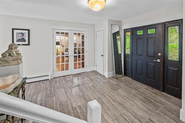 5 Bellwood Ln, Cornwall On Hudson, NY 12520 - foyer entrance with french doors, a baseboard radiator, wood finished floors, and baseboards