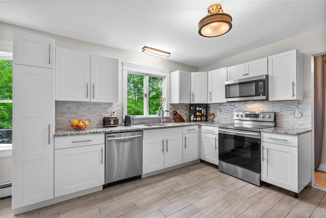5 Bellwood Ln, Cornwall On Hudson, NY 12520 - kitchen featuring appliances with stainless steel finishes, a sink, and decorative backsplash
