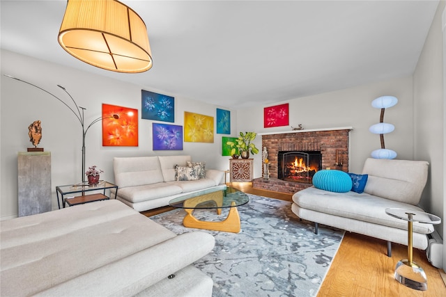 5 Bellwood Ln, Cornwall On Hudson, NY 12520 - living area with wood finished floors and a brick fireplace