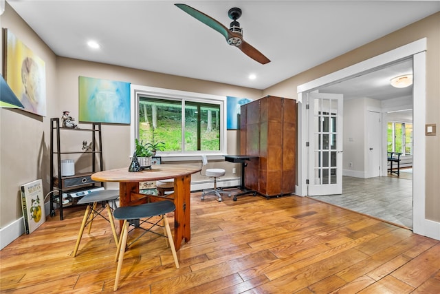 5 Bellwood Ln, Cornwall On Hudson, NY 12520 - dining space featuring ceiling fan, baseboard heating, light wood-style floors, and french doors