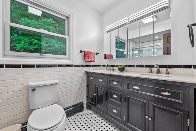 5 Bellwood Ln, Cornwall On Hudson, NY 12520 - bathroom with tile walls, a wainscoted wall, toilet, and double vanity