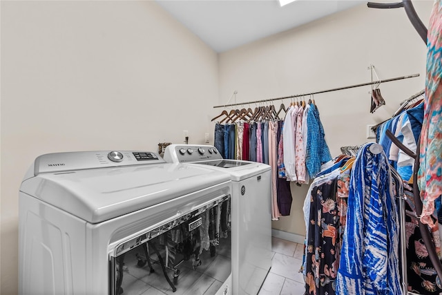 5 Bellwood Ln, Cornwall On Hudson, NY 12520 - laundry area with washer and clothes dryer and light marble finish flooring