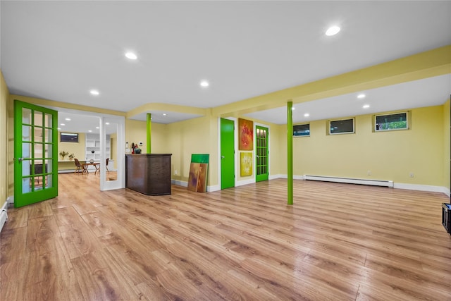 5 Bellwood Ln, Cornwall On Hudson, NY 12520 - unfurnished living room featuring baseboard heating, light wood-style flooring, recessed lighting, french doors, and baseboards