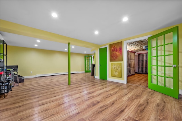 5 Bellwood Ln, Cornwall On Hudson, NY 12520 - unfurnished living room featuring baseboard heating, wood finished floors, baseboards, and recessed lighting