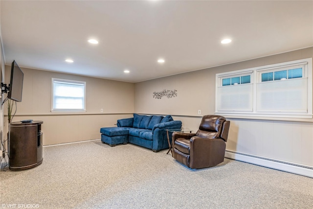living room featuring carpet flooring, a baseboard heating unit, and recessed lighting