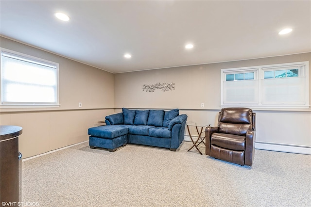 living area with carpet flooring, a baseboard radiator, and recessed lighting