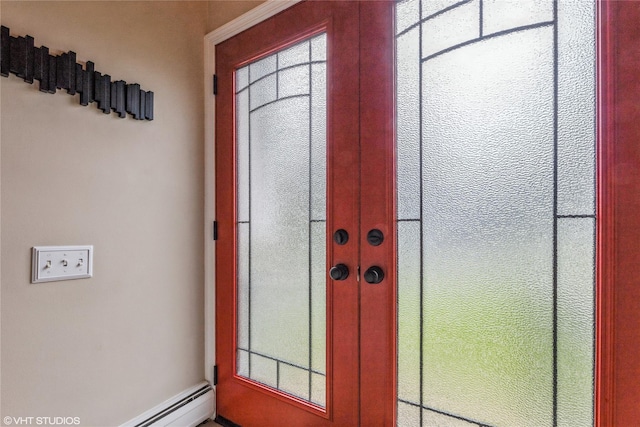 entrance foyer with healthy amount of natural light and a baseboard heating unit