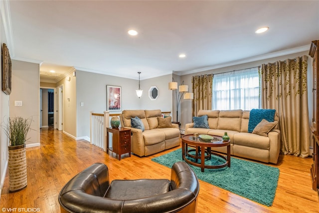 living area with recessed lighting, ornamental molding, wood finished floors, and baseboards