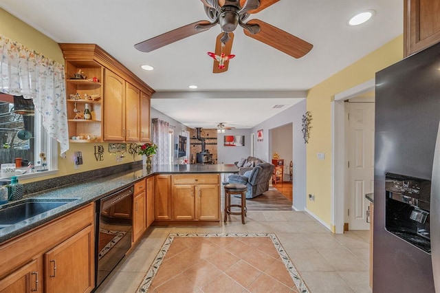 kitchen with a ceiling fan, stainless steel fridge with ice dispenser, black dishwasher, open shelves, and a peninsula